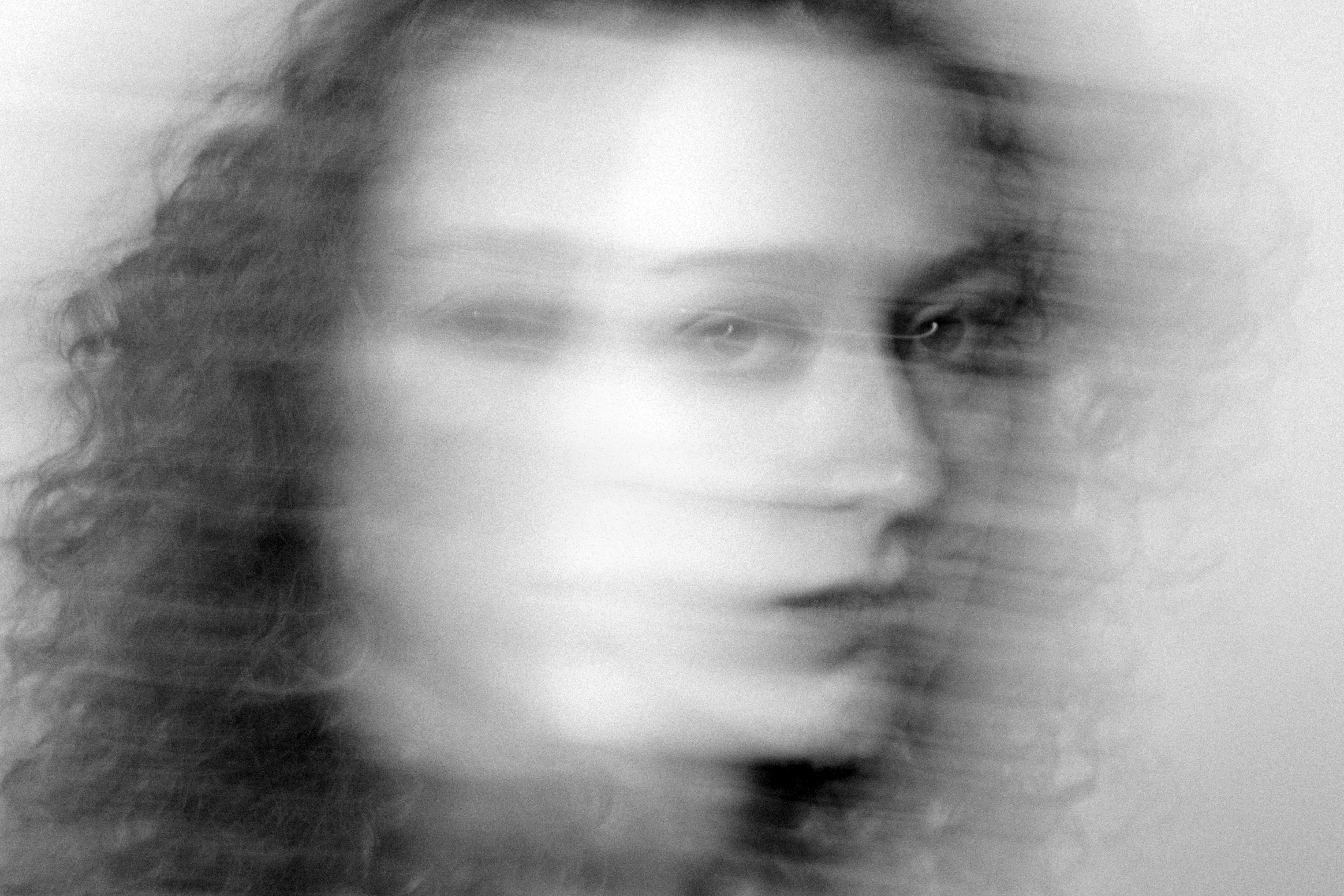 A face rendered almost entirely by motion blur