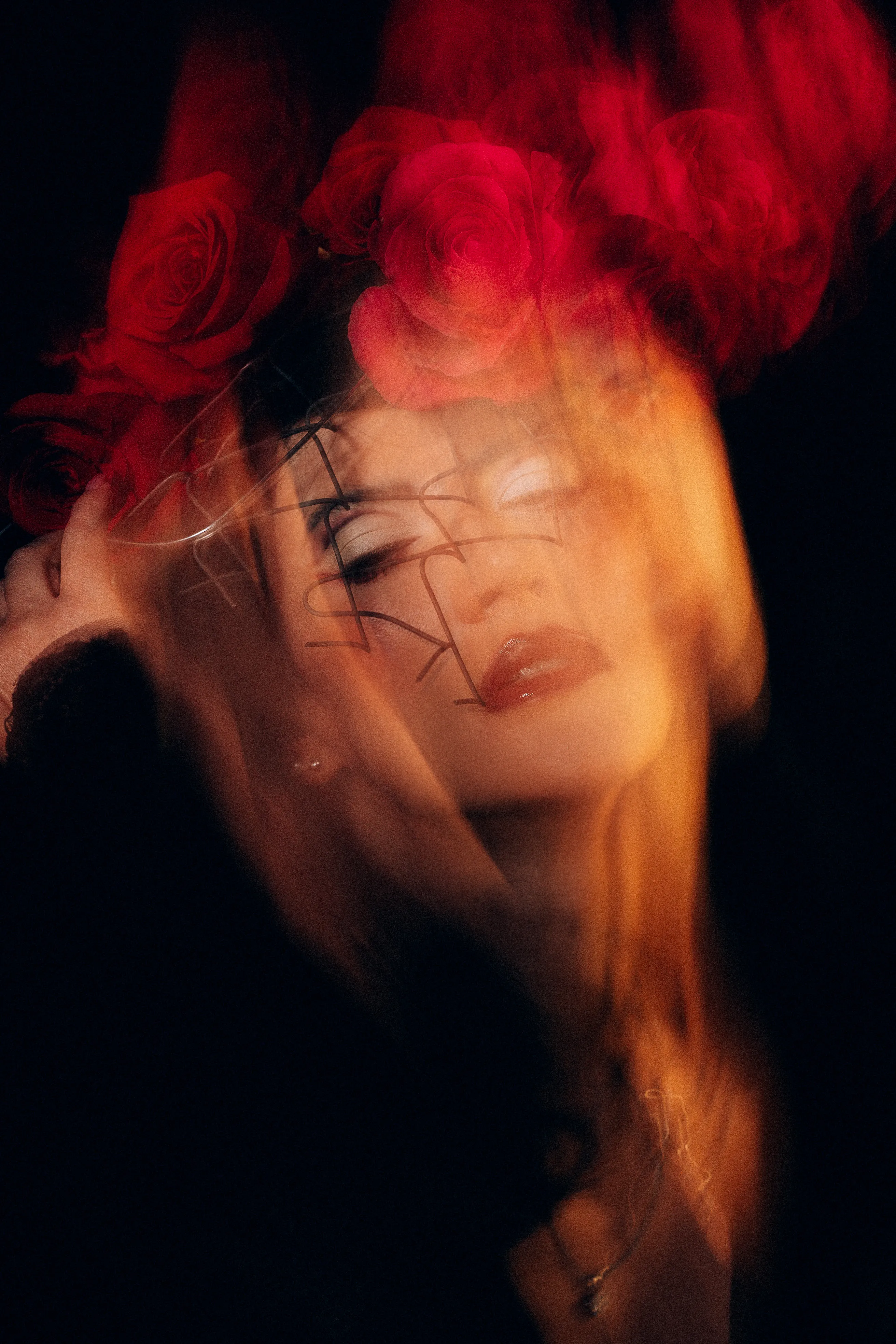 Abstract motion-blurred portrait in warm red and orange tones